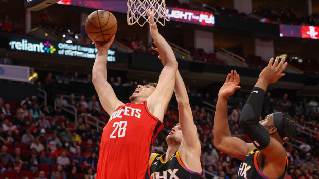 Rockets center Alperen Sengun shoots against Phoenix Suns center Jock Landale (11) in the second half at Toyota Center.